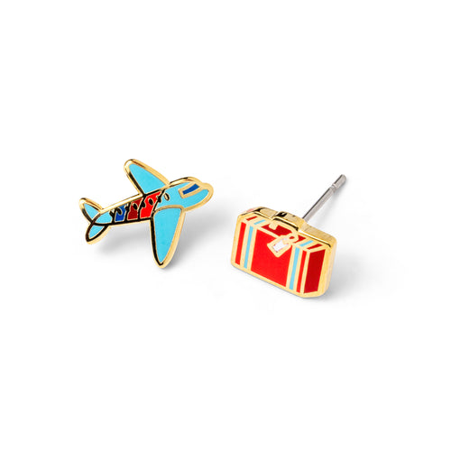 Mismatched cloisonné stud earrings featuring blue airplane and red striped suitcase gilded in 22 karat gold by Yellow Owl Workshop
