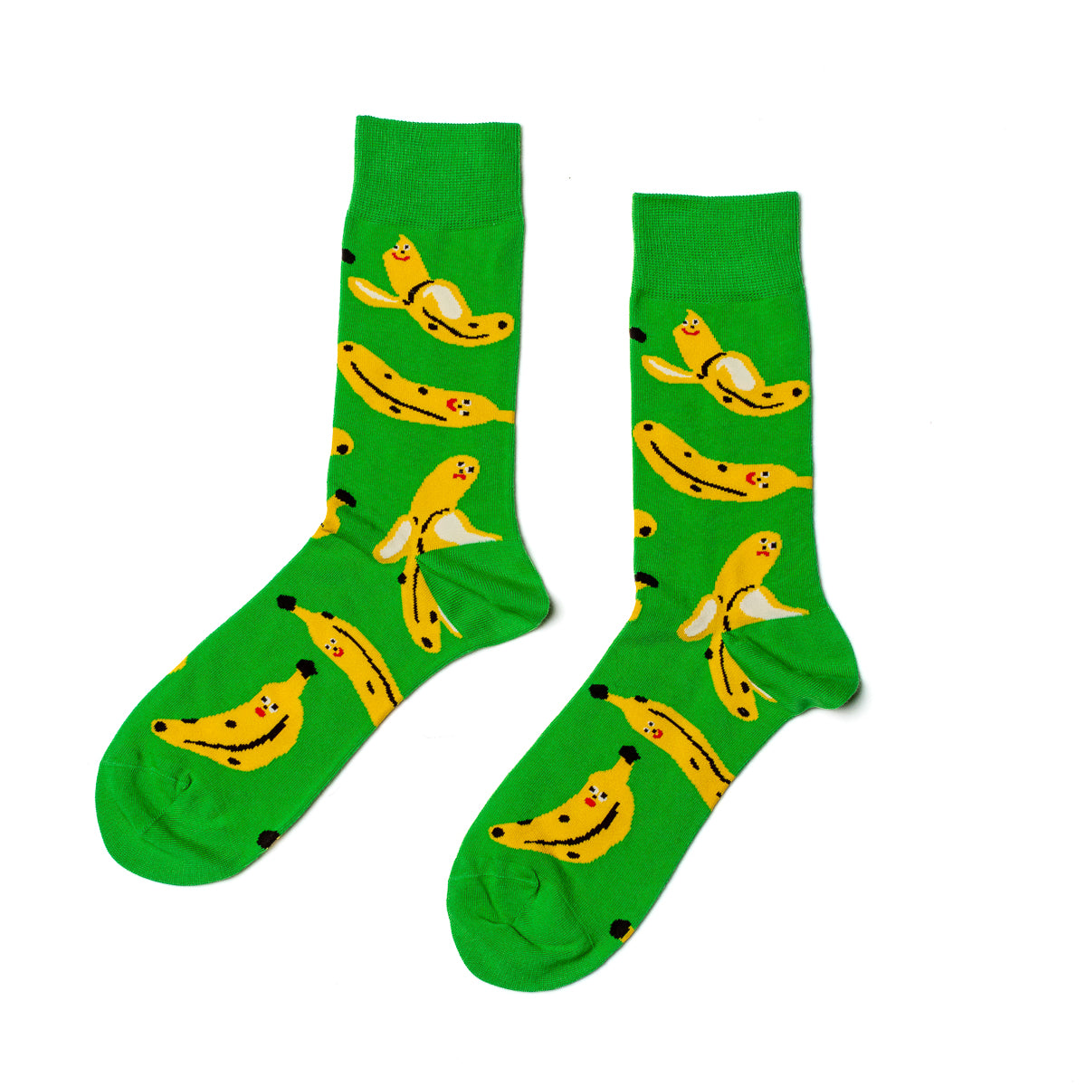 Bright green crew socks featuring playful illustrated banana characters by Kristina Micotti for Yellow Owl Workshop