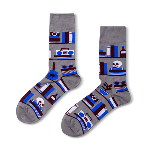 Grey crew socks featuring illustrated bookshelves with books skull camera and sunglasses in blue brown and white by Yellow Owl Workshop