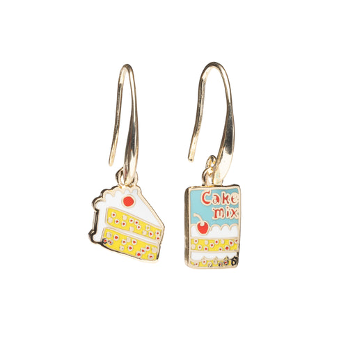 Mismatched enamel drop earrings featuring yellow confetti cake slice with white frosting and cherry and cake mix box by Yellow Owl Workshop