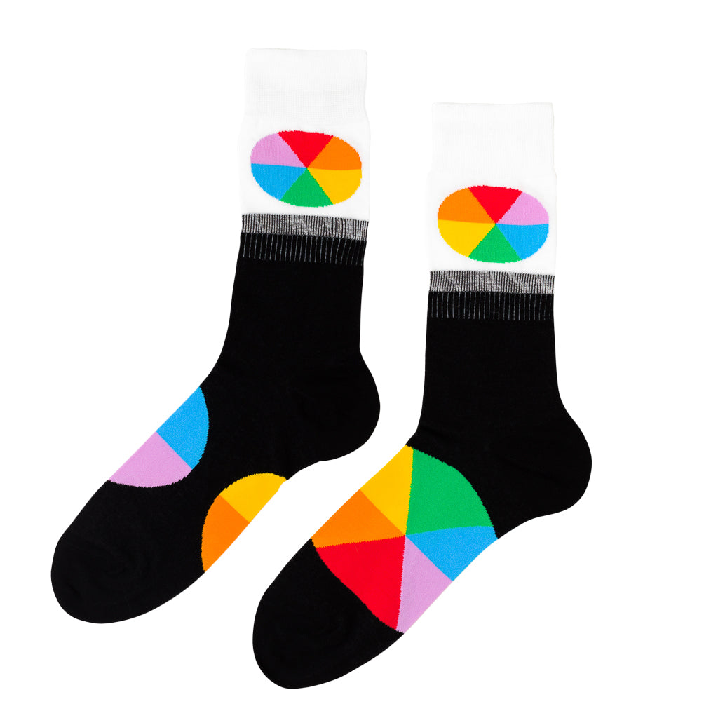 Black and white crew socks featuring bold multicolor color wheel on cuff and sole by Yellow Owl Workshop