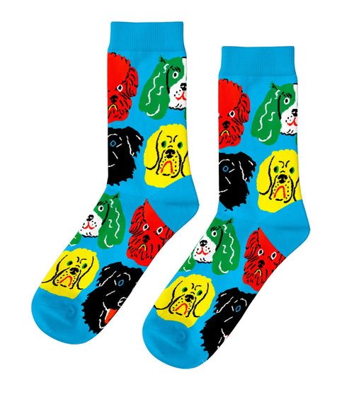 Bright blue crew socks featuring bold colorful illustrated dog faces in red yellow green and black by Kristina Micotti for Yellow Owl Workshop