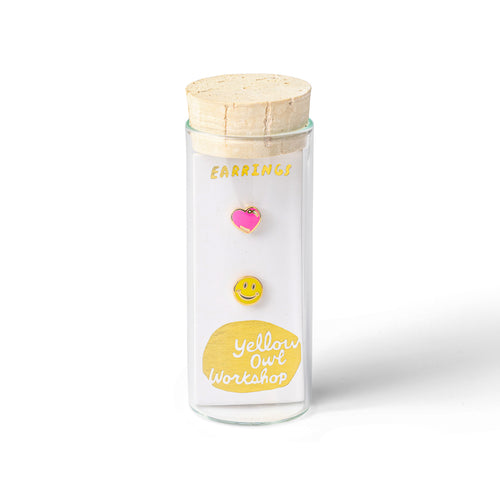 Happy Face and Heart mismatched gold stud earrings in gift-ready glass vial by Yellow Owl Workshop
