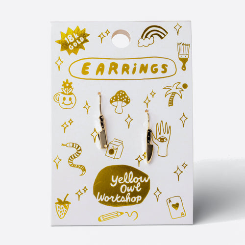Knife and Cleaver mismatched enamel drop earrings on gold foil matchbook card by Yellow Owl Workshop