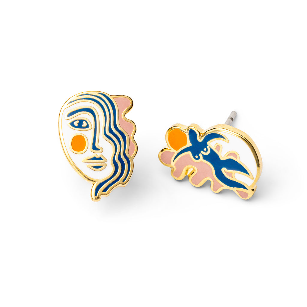 Mismatched cloisonné stud earrings inspired by Matisse featuring portrait face and swirling figure in blue pink and orange gilded in 22 karat gold by Yellow Owl Workshop