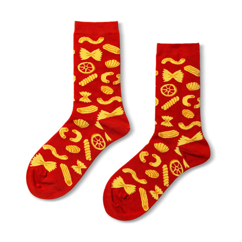 Red crew socks featuring illustrated pasta shapes including farfalle fusilli and rigatoni by Yellow Owl Workshop
