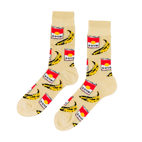 Cream crew socks featuring Warhol-inspired soup can and banana illustrations in red yellow and black by Yellow Owl Workshop