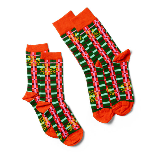 So Freaking Merry crew socks small and large sizes laid out side by side by Yellow Owl Workshop