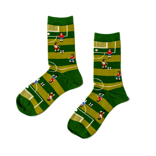 Green crew socks featuring illustrated soccer players goal and ball on striped pitch by Yellow Owl Workshop