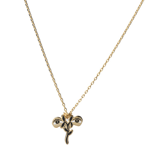 Gold cloisonné St. Lucy pendant necklace featuring two eyes and gold flower gilded in 22 karat gold by Yellow Owl Workshop