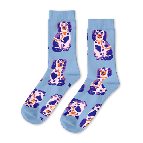 Pale blue crew socks featuring illustrated Staffordshire spaniel figurines in purple white and orange by Yellow Owl Workshop