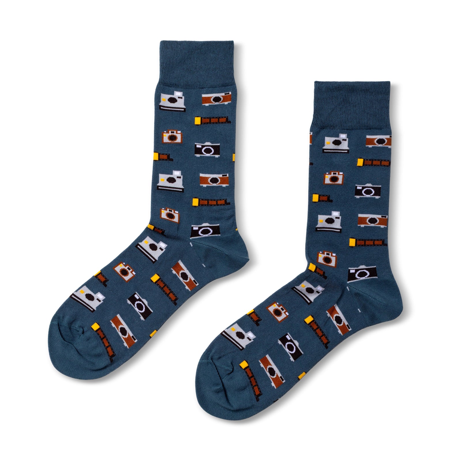 Blue crew socks featuring illustrated vintage cameras and film strips in brown black and white by Yellow Owl Workshop