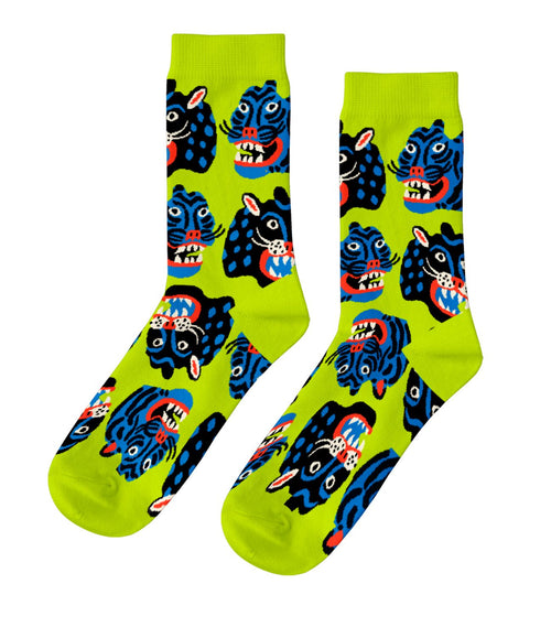 Bright green crew socks featuring bold graphic wildcat face illustrations by Kristina Micotti for Yellow Owl Workshop