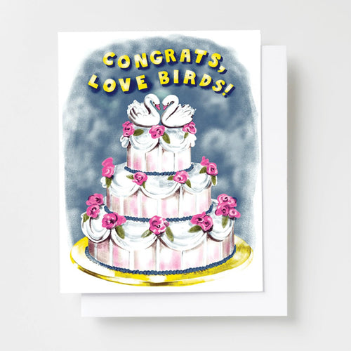 Risograph greeting card with an illustrated three-tier wedding cake decorated with pink roses and swan toppers on a cloudy blue background, text reads Congrats Love Birds in bold yellow lettering