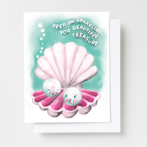 Risograph greeting card with two illustrated pearl characters nestled in a pink scallop shell on a teal background with bubbles, text reads Keep On Sparkling You Beautiful Treasure in white lettering