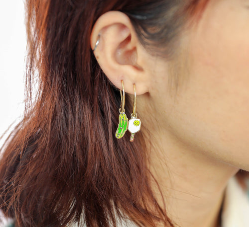 Pickleball mismatched enamel drop earrings worn on ear by Yellow Owl Workshop