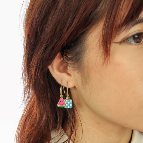 Watermelon Picnic mismatched enamel drop earrings worn on ear by Yellow Owl Workshop