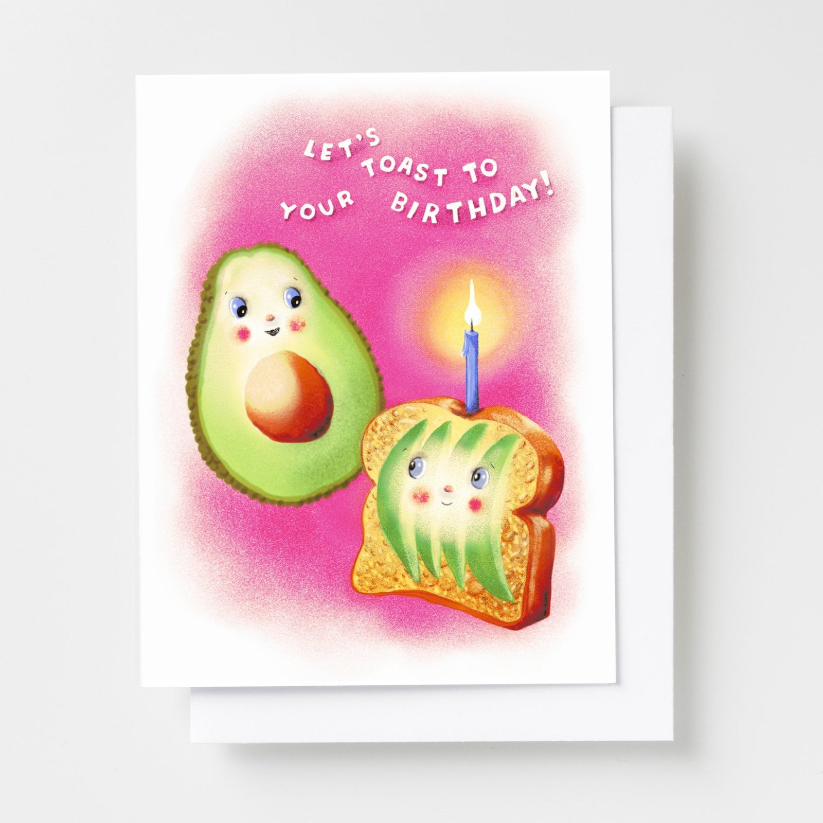 Risograph greeting card with illustrated smiling avocado and avocado toast characters with a birthday candle on a pink background, text reads Let's Toast to Your Birthday in white lettering