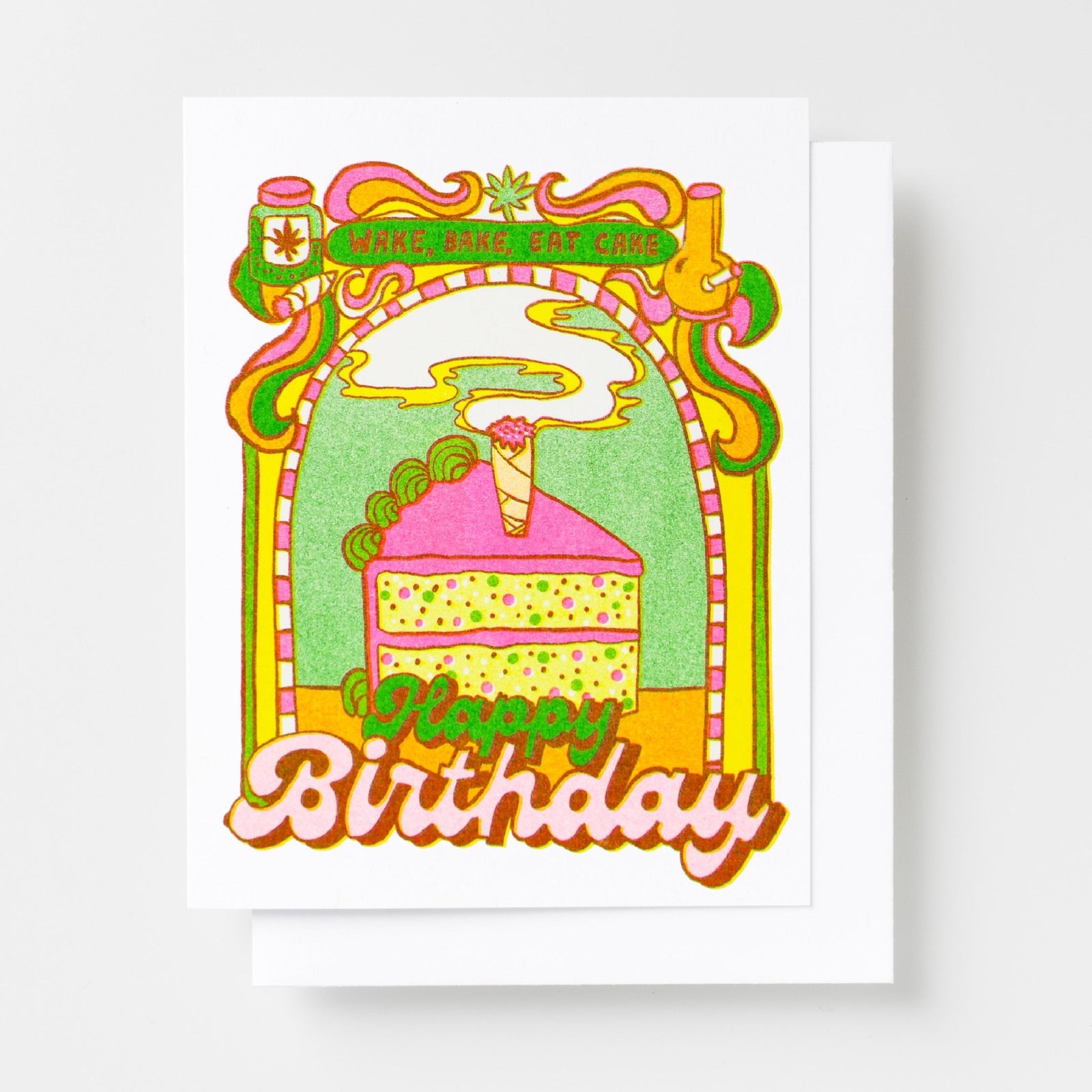 Risograph greeting card with a psychedelic illustrated birthday cake slice with a joint candle in an ornate green and pink arch, banner reads Wake Bake Eat Cake, text reads Happy Birthday in bold pink lettering